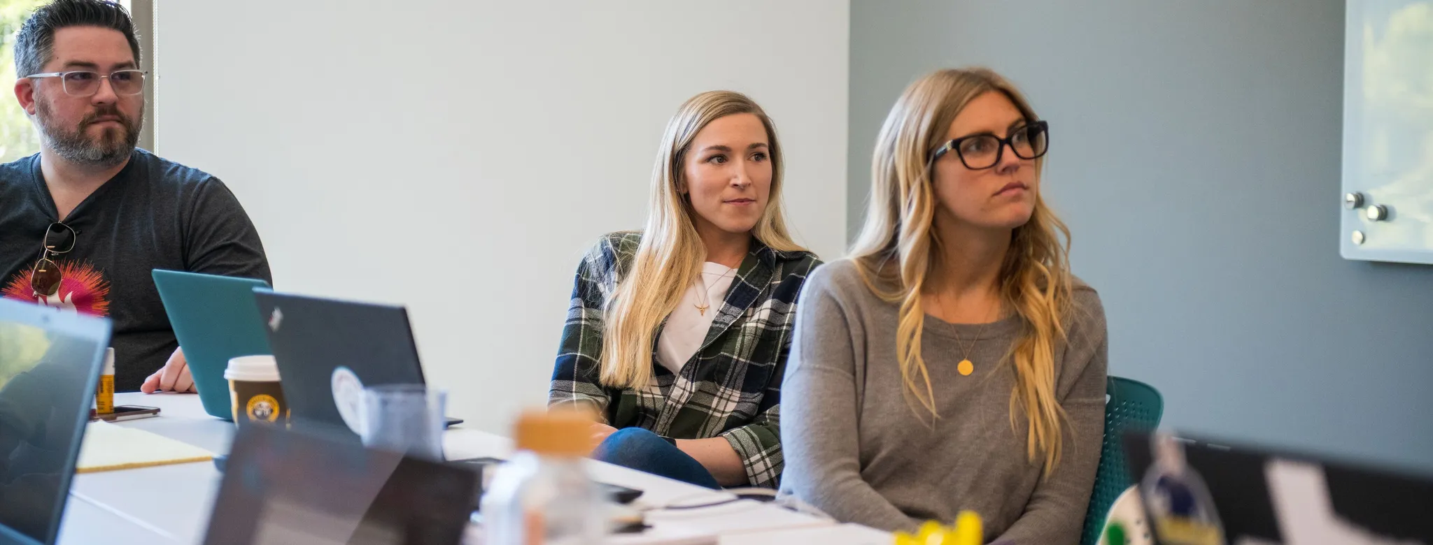 Three colleagues in a corporate work meeting